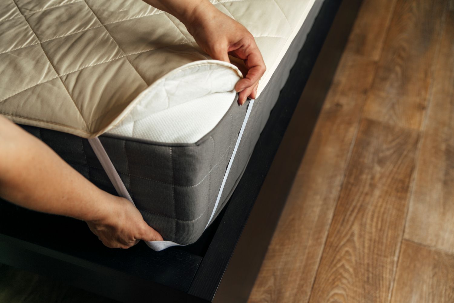 putting mattress protector on bed